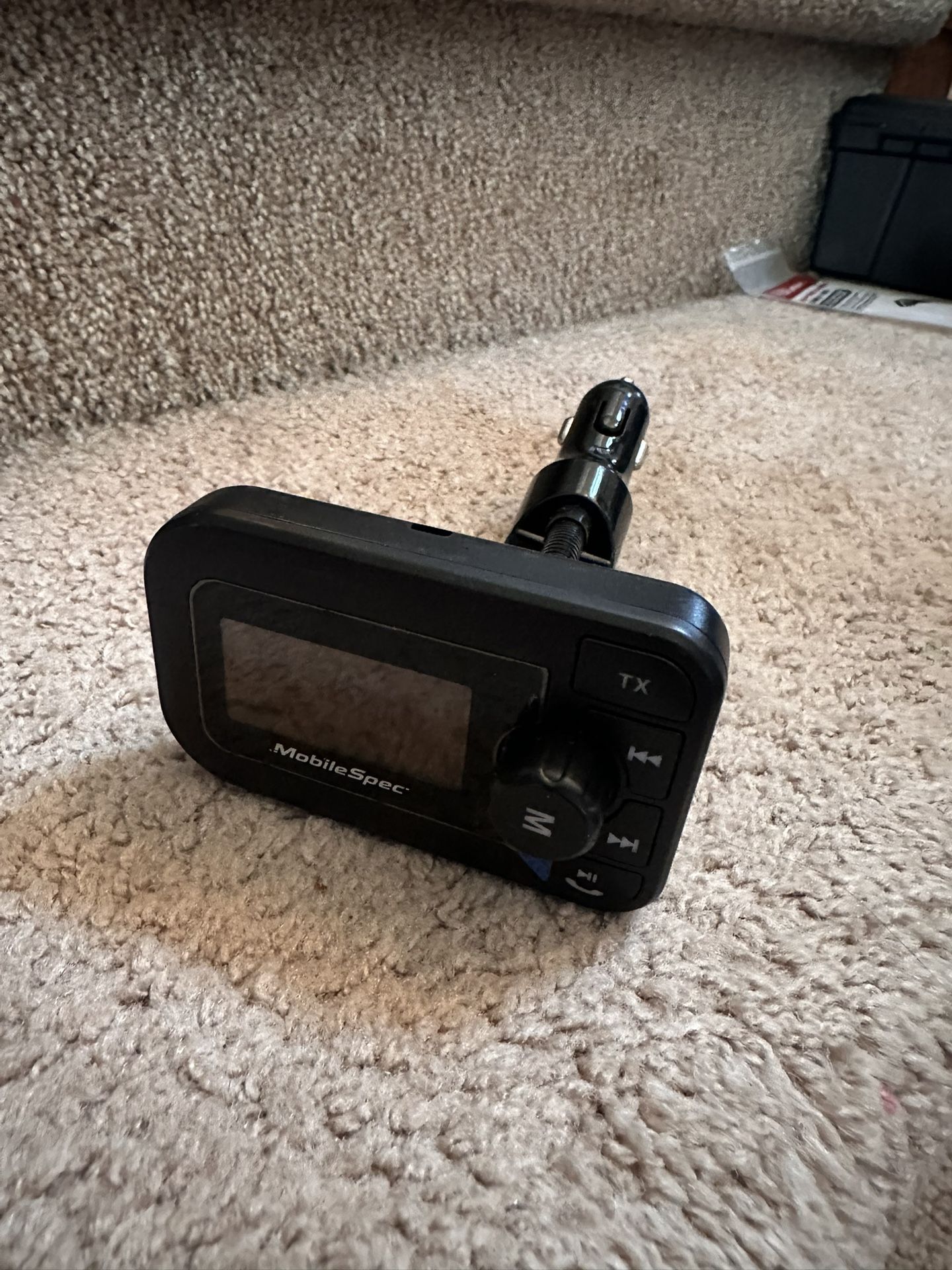 MobileSpec FM transmitter with a USB charging port and an XL display