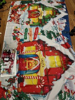 44”x74” Christmas northerly elves banner  And 2 rectangular table plastic cloths