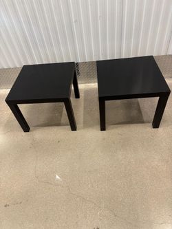 Two black  l a c q u e r   side  t a b l e s .  22” square x 18” high .  $20 each