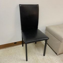 Modern Black Chair with metal legs, in excellent condition