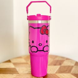 NEW Hello Kitty 30oz Tumbler.Double wall Stainless Cup keeps cold and hot drinks. Flip straw and hand carry handle.   FEATURES: Double-wall vacuum ins