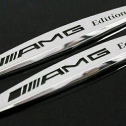 2 new metal AMG edition badge fender emblems adhesive back black or silver.   SHIPPING IS AVAILABLE 