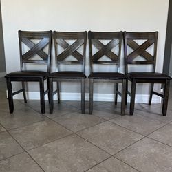 4 beautiful wooden and leather dining room chairs