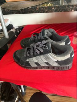 Size  11 These are Adidas LWST sneakers in a Core Black and Carbon Grey colorway, featuring a distinctively thick rubber sole