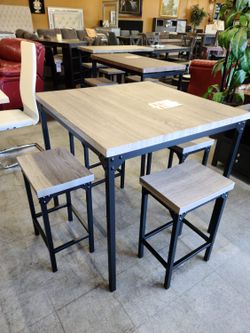 Grey counter height table with 4 stools