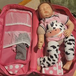 DOLL WITH CASE AND SOME CLOTHES 