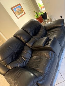 Leather reclining sofa and loveseat