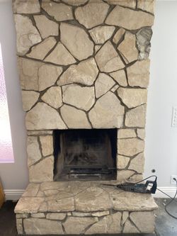 Stone rock fireplace meticulously taken apart