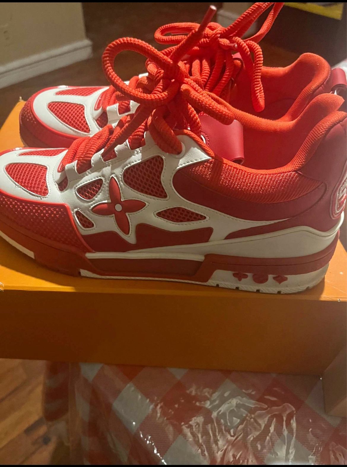 Red and white Louis Vuitton sneakers