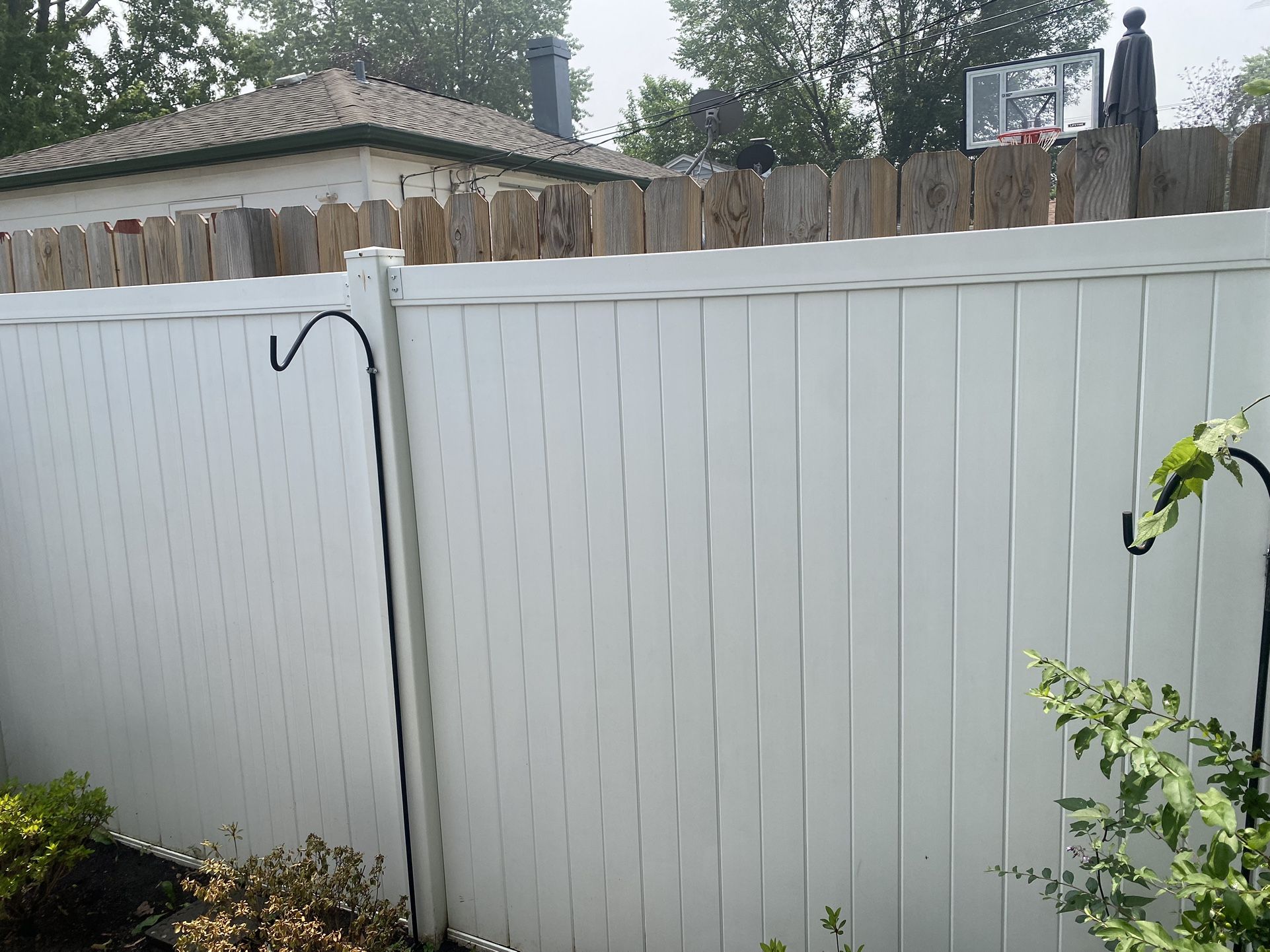 One Story Gutter Cleaning 50100. White Plastic Fences Power Washed 100