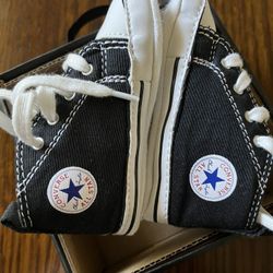 There Very Cute CONVERSE little Shoes For Little Boy. The Size Is 4 The Color Is Black And White Never Been Used 