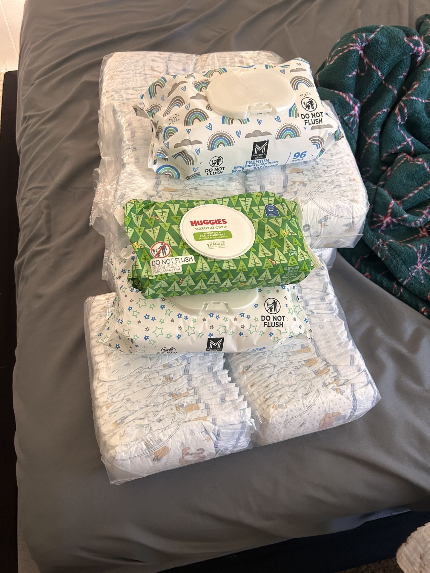 4 packs of huggies diapers and wipes