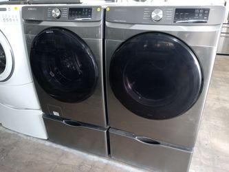 Samsung gray front load washer and dryer set on pedestals - Free delivery