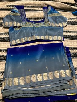 Saree: very beautiful saree with stitched blouse .
