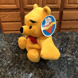 Winnie The Pooh Bear Bean Bag Plush.  Size 6 inches Tall .  Brand New With Tags Has been on display in a cabinet with a Plush Beanbag collection.  Smo