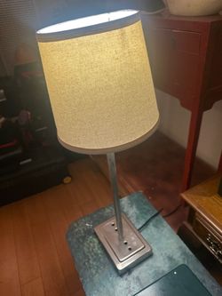 modern brushed metal desk/table lamp featuring an integrated power base