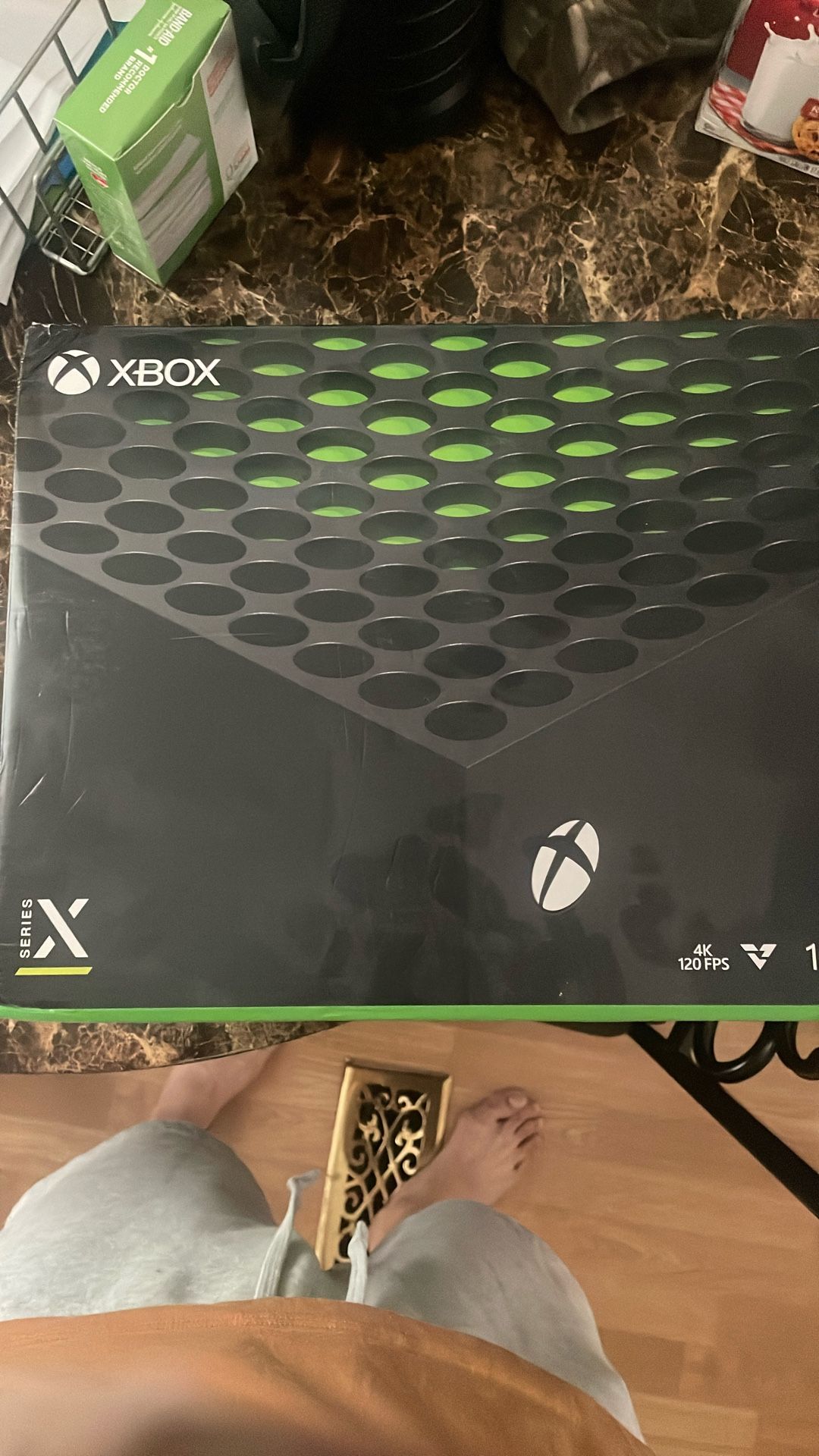 The image shows an Xbox Series X console, which is the more powerful of the two current-generation Xbox consoles