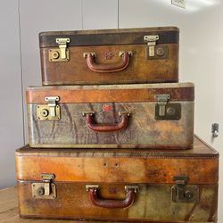Trio of antique leather suitcases from JE Fournier Montreal From Brimfield antiques Keys 