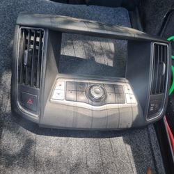 Nissan Maxima Display Screen Bezel and Climate Control unit designed for model years 2009-2014.