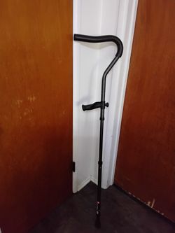 Ergonomic adjustable in motion cane.  Like New