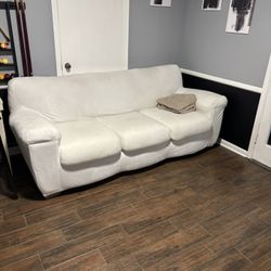 Very Nice Sofa/couch, beige with a white cover