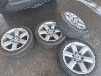 18" nissan rims for hardbody ready to mount 400$ obo