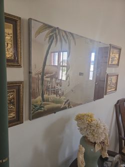 Rectangular wall mirror with etchings.