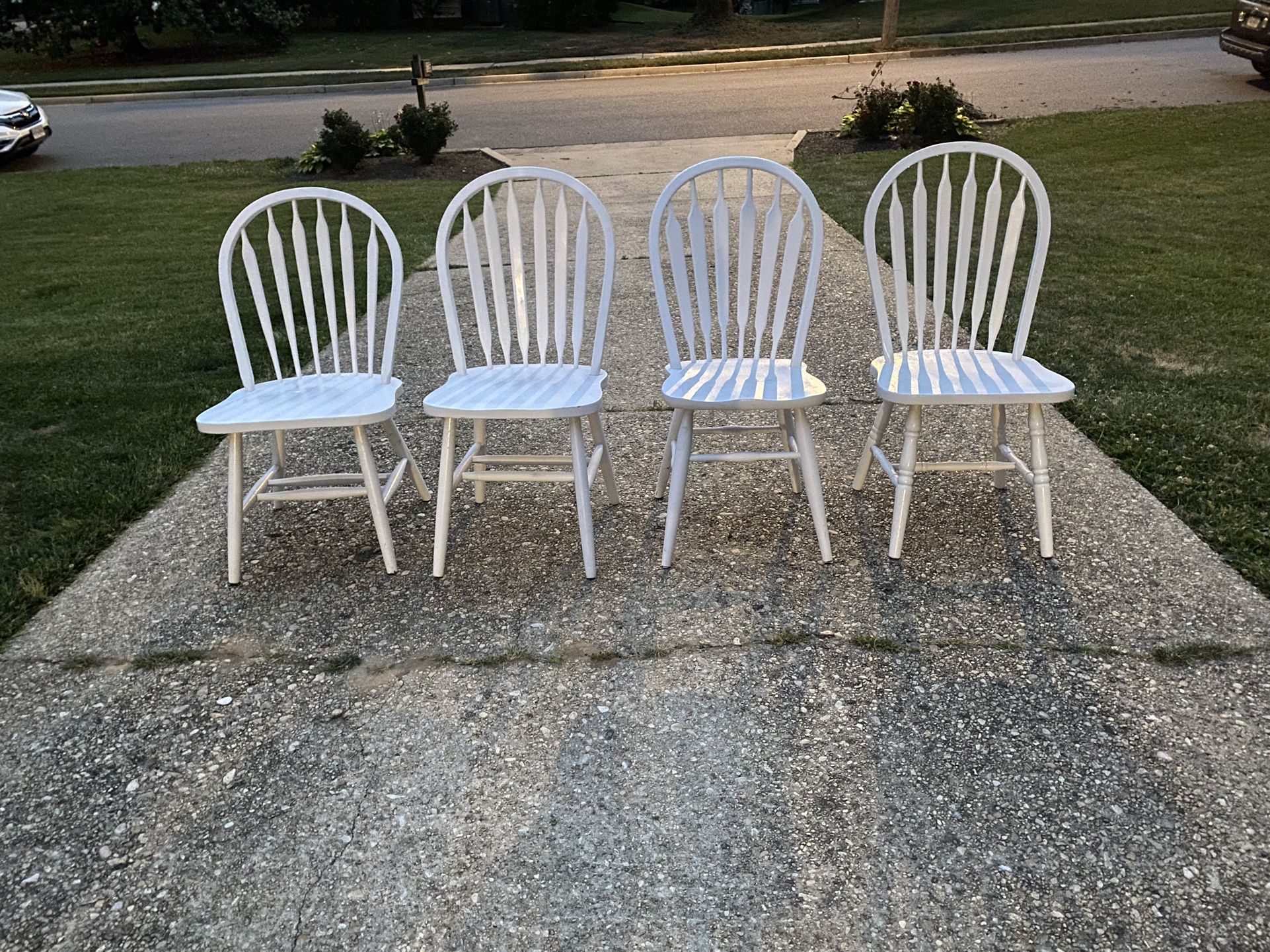Four White Mismatched Chairs 