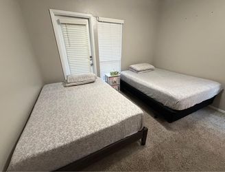 2 bed frames and 2 mattresses