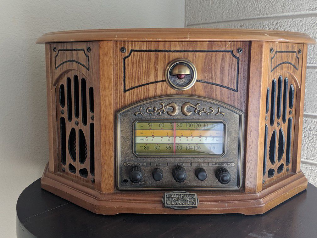 Solid wood electric radio made to look antique, has a secret hiding place or jewlery box.