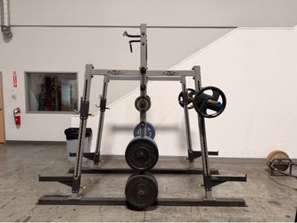 Tuff stuff power rack with weights and bar