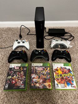 XBOX 360 with controllers and games