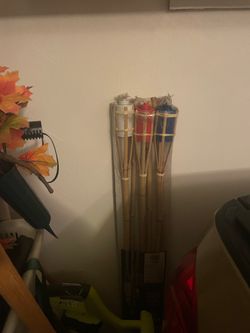 Five tiki torches and fuel
