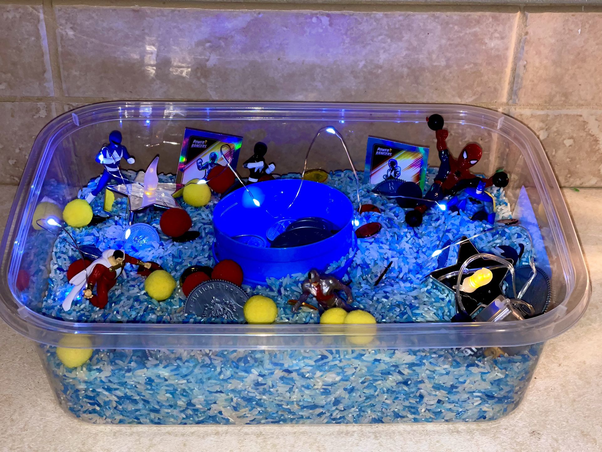 Rice Sensory Bin- Super Hero Themed 