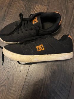 DC Shoes black with orange sneakers