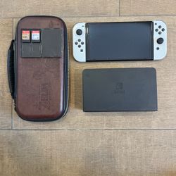 Nintendo Switch Oled Bundle - Includes Super Smash Bro. & Zelda: Breath Of The Wild