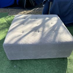 Ladlows Gray Chenille Ottoman Used For Staging