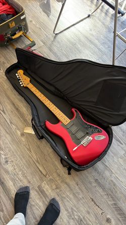 Fender Mexican Stratocastor guitar and gig bag