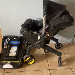 A Bundle For Kids Seat With Wheels And A Thing To Strap To The Car