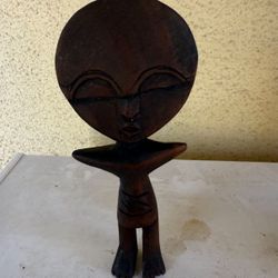 This African tribal alien figurine is in mint condition and it is brown. It is a very neat and cool collectible to decorate in your home or to collect