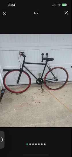 Fixie With Red Rims And Tires.