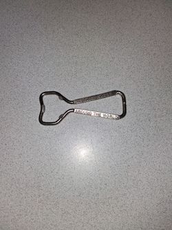 RARE VINTAGE DOUBLE SIDED HILTON HOTELS AROUND THE WORLD BOTTLE OPENER