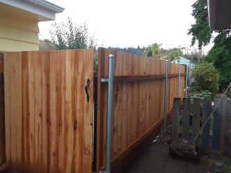 Fence installed and decks for trade for RV are trailer