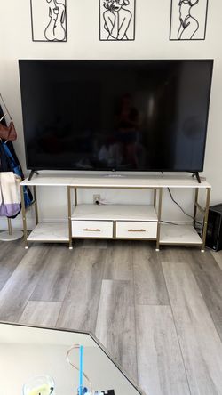 Tv stand with gold legs and handles