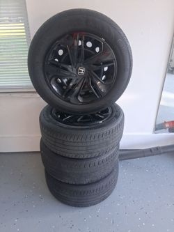 4 good like new Honda tires and Rams