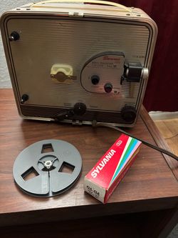 1950’s vintage Kodak 8mm movie projector and film editor and projection screen