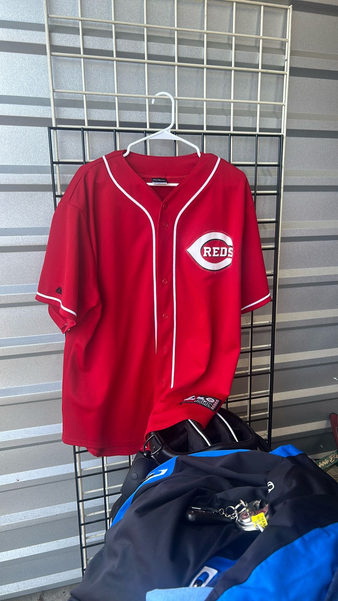 Reds baseball jersey.