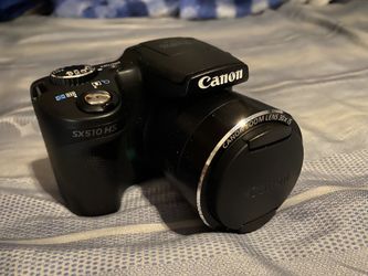 Canon Sx510 HS camera and tripod included with battery’s and SD card