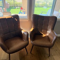 Two brown leather chairs
