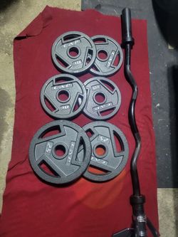 2" HOLE EZ-CURL BAR WITH 90LBSs OLYMPIC PLATES  2-25s  4-10s  
11525 S HALSTED/7111.S WESTERN 
115$  CASH ONLY AS IS